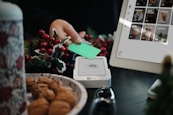 A table with a plate of food and a laptop on it