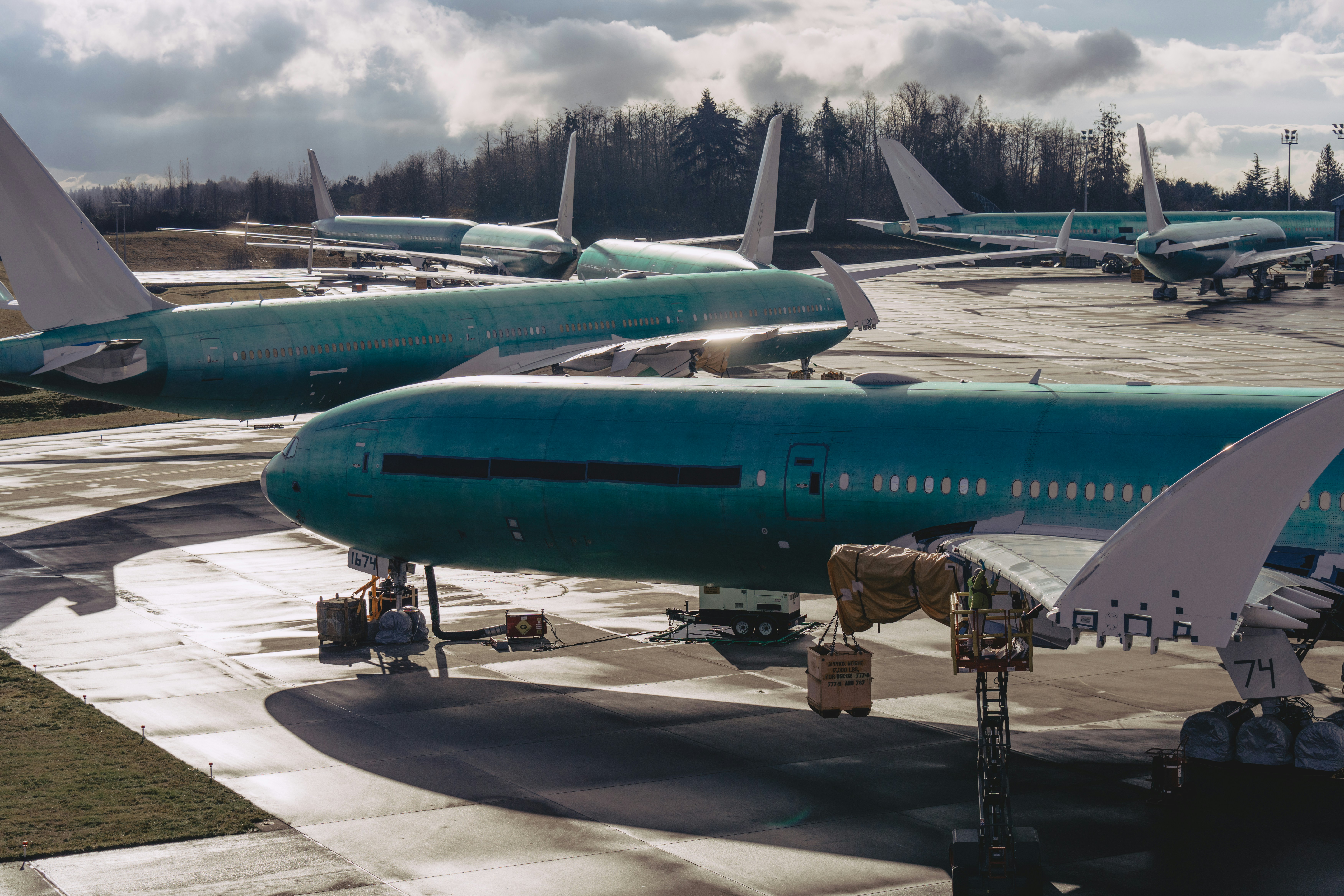 A group of airplanes sitting on top of an airport tarmac