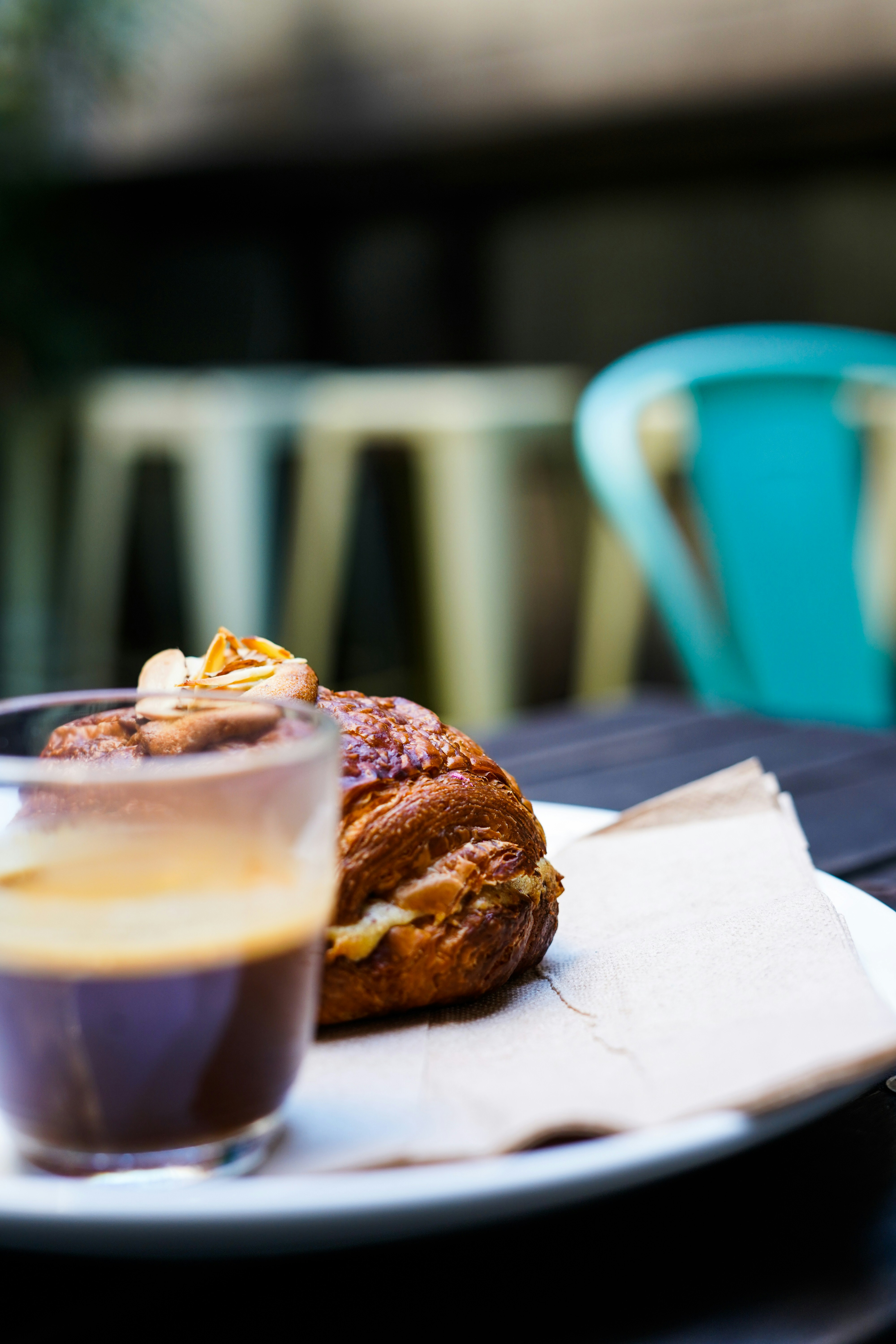 A plate of food and a drink on a table