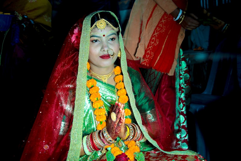 A woman dressed in a red and green outfit
