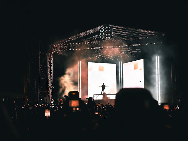 A crowd of people standing on top of a stage