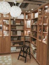 A room filled with lots of wooden shelves