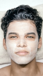 A man with a facial mask on his face