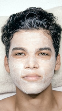 A man with a facial mask on his face