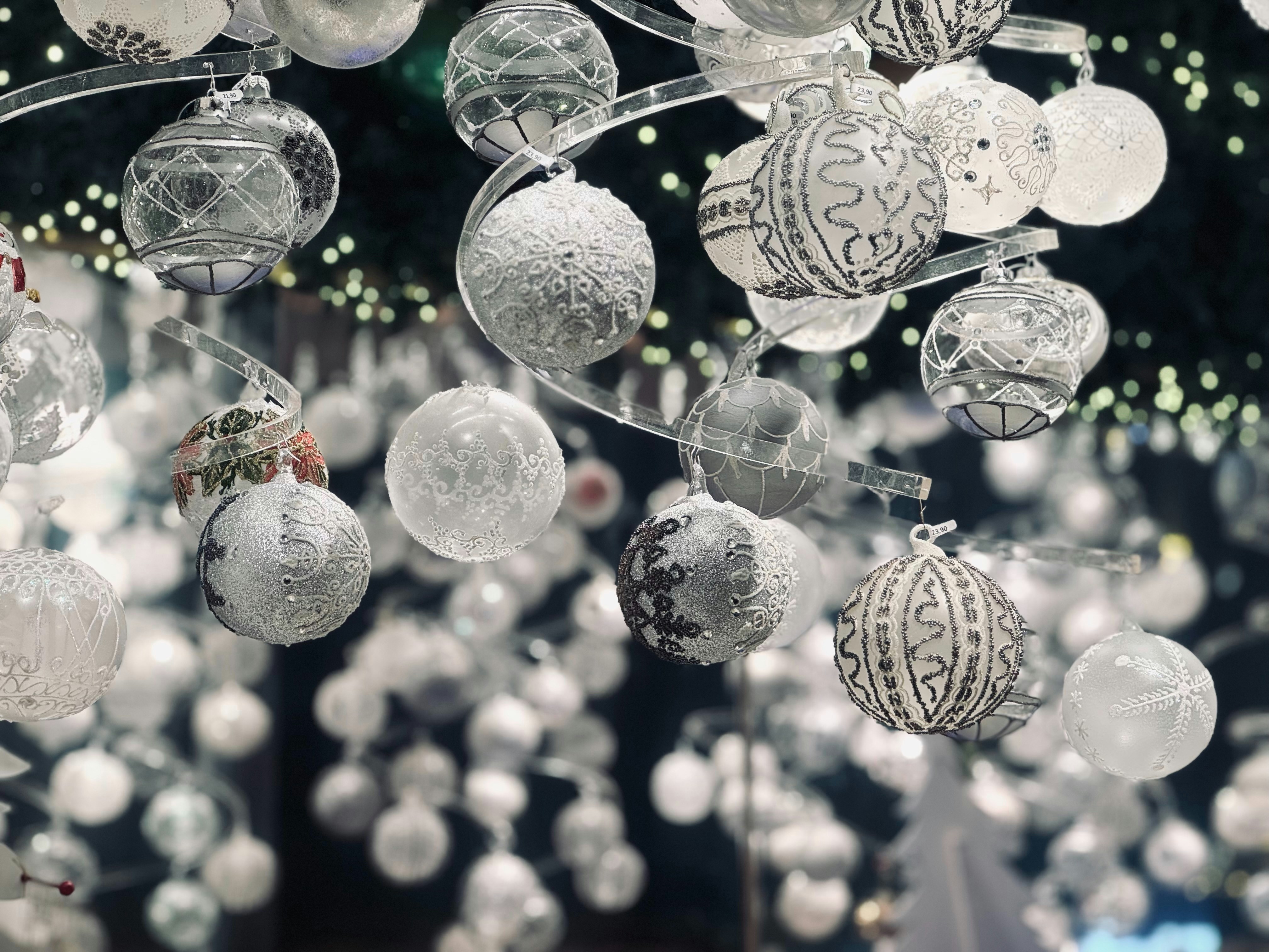 A bunch of ornaments hanging from a ceiling