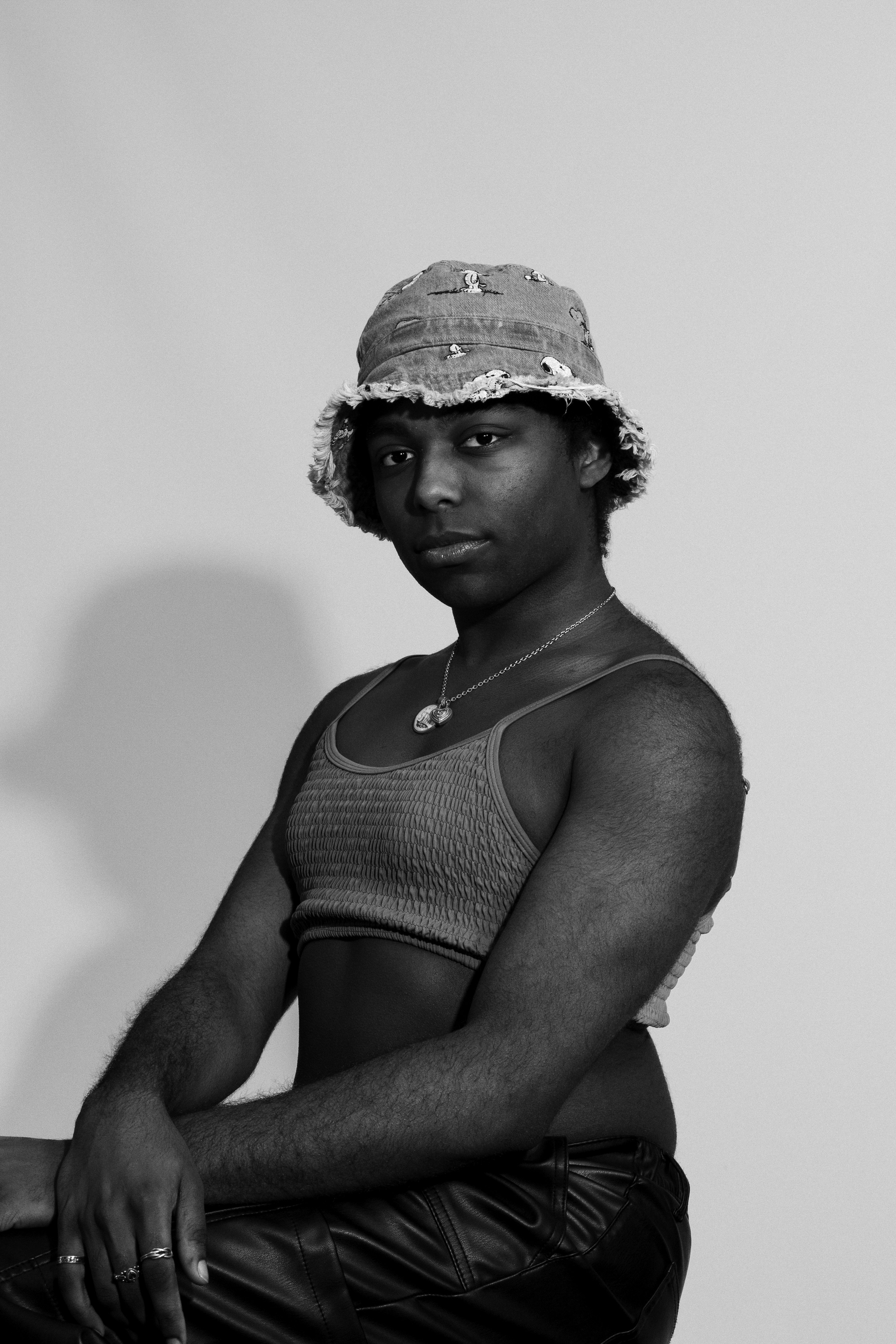 A black and white photo of a woman wearing a hat