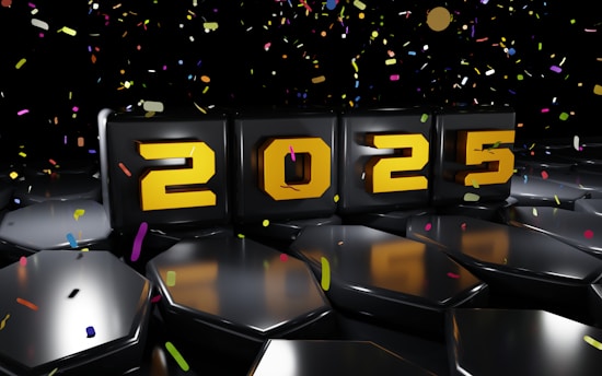A number of black chairs with confetti around them