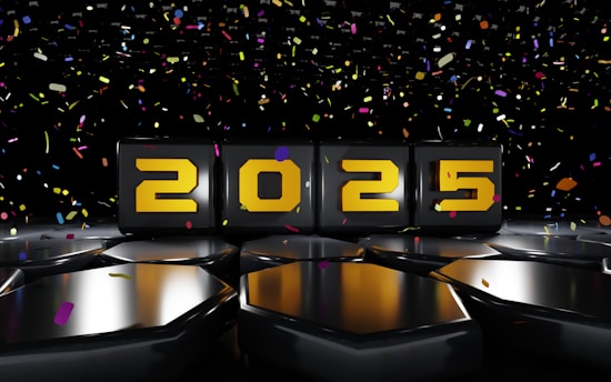 A black table topped with black plates covered in confetti