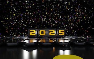 A black stage with yellow numbers and confetti