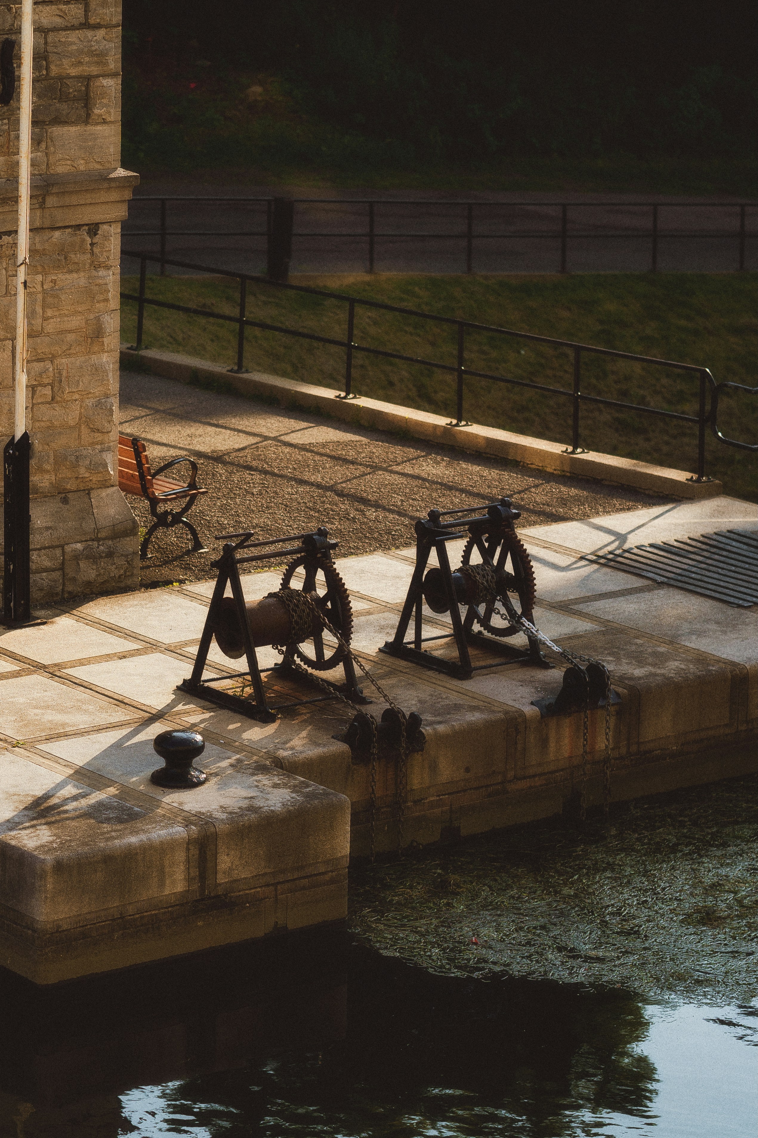 A clock tower sitting next to a body of water