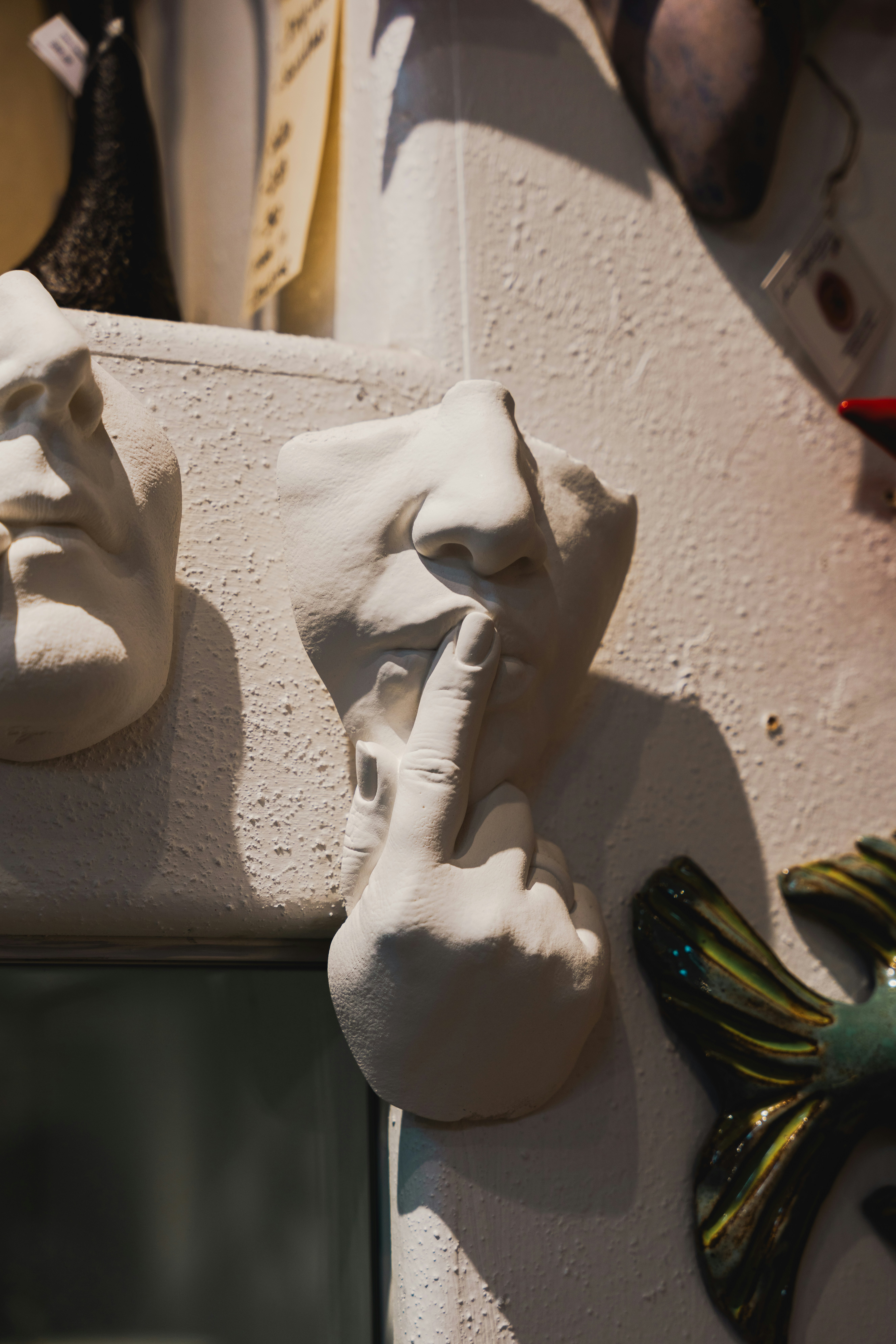 <li>The Rise of Political Satire: How Humor Influences Public Opinion</li> – A couple of masks are hanging on a wall