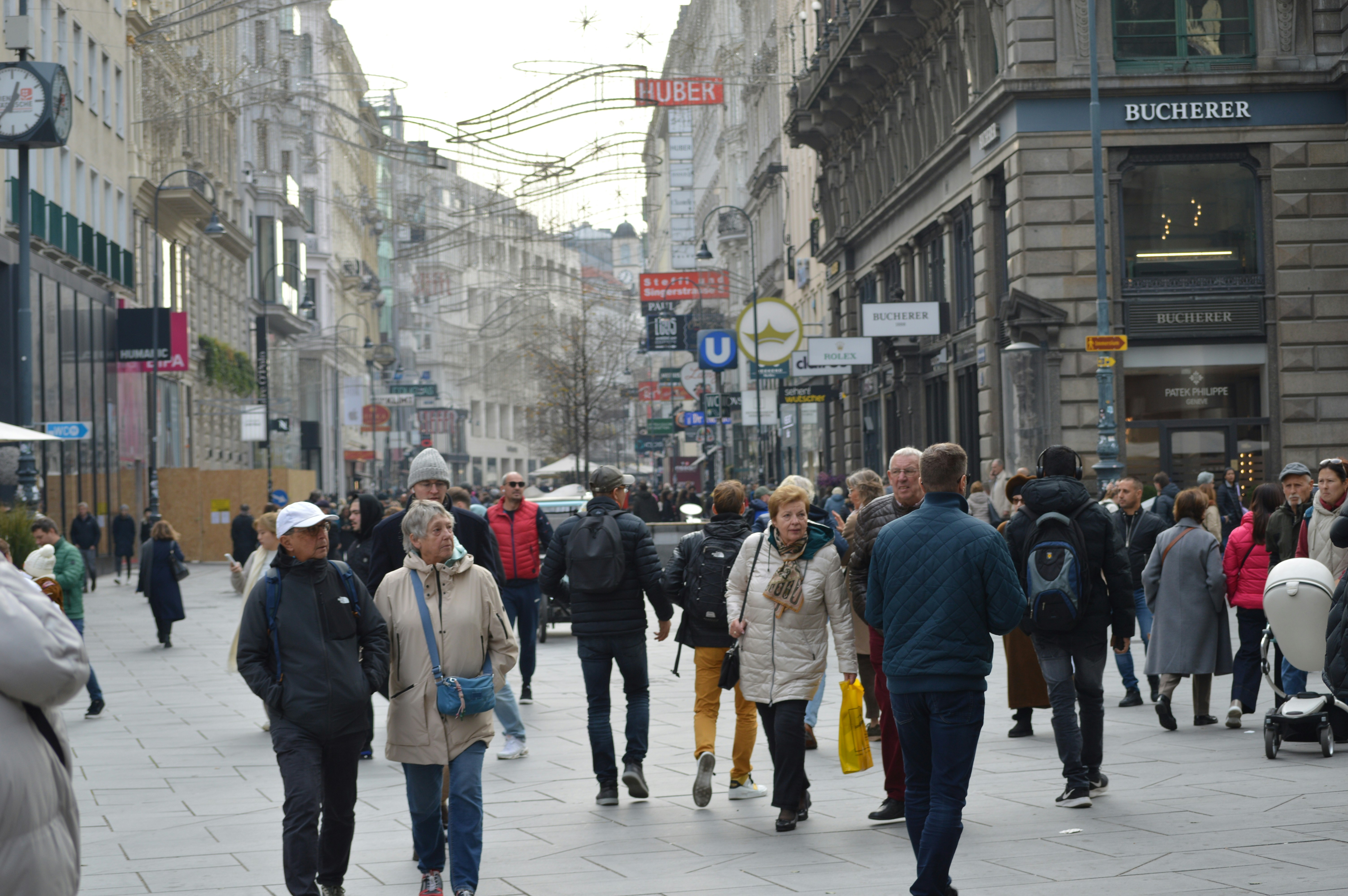 Crowds walking along a street in Vienna, Austria