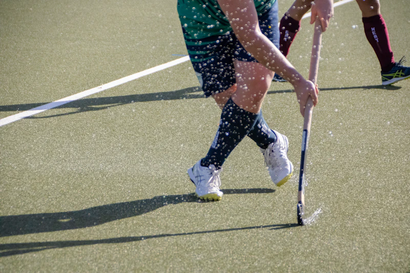 Field hockey player with stick