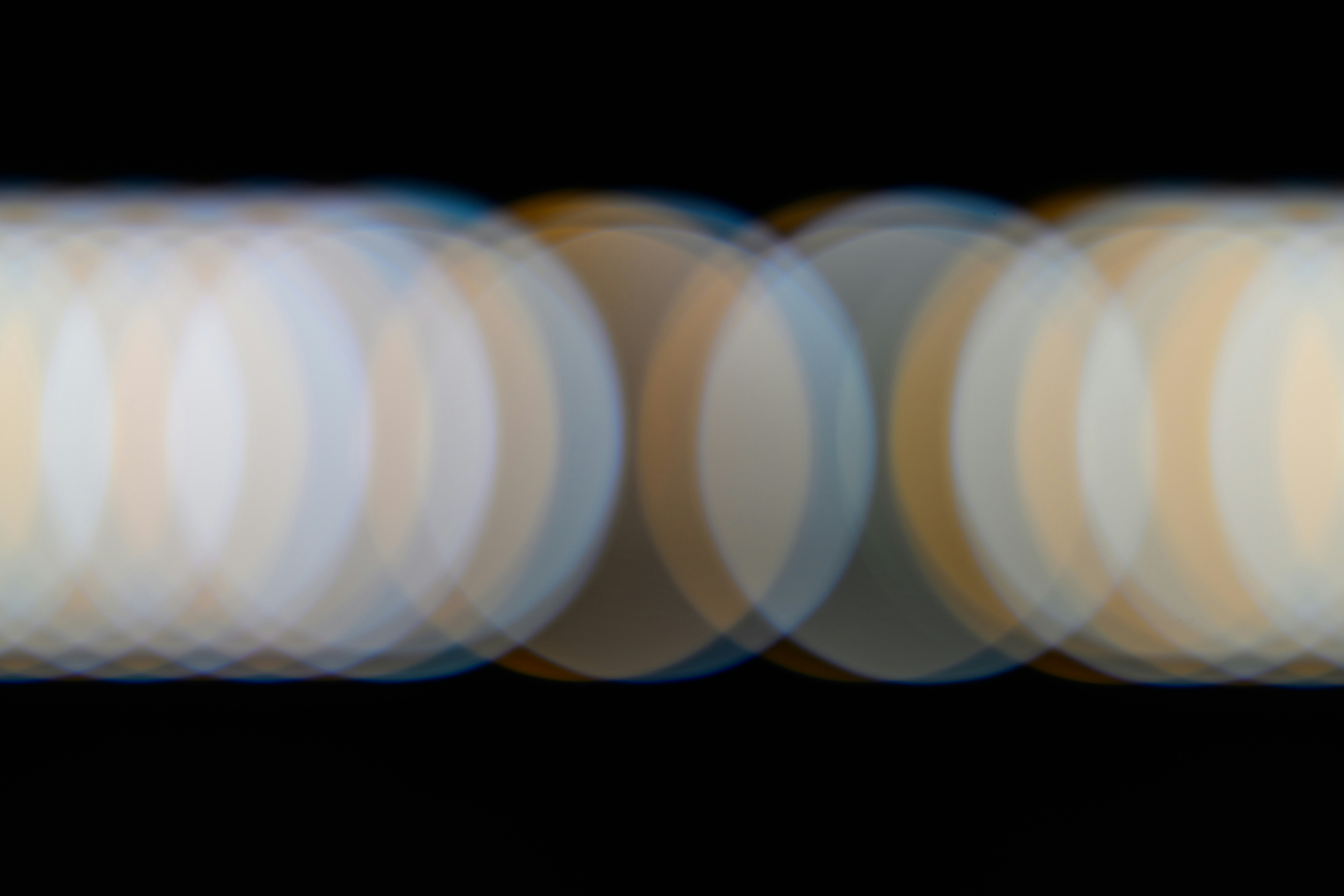 A blurry photo of a white object in the dark