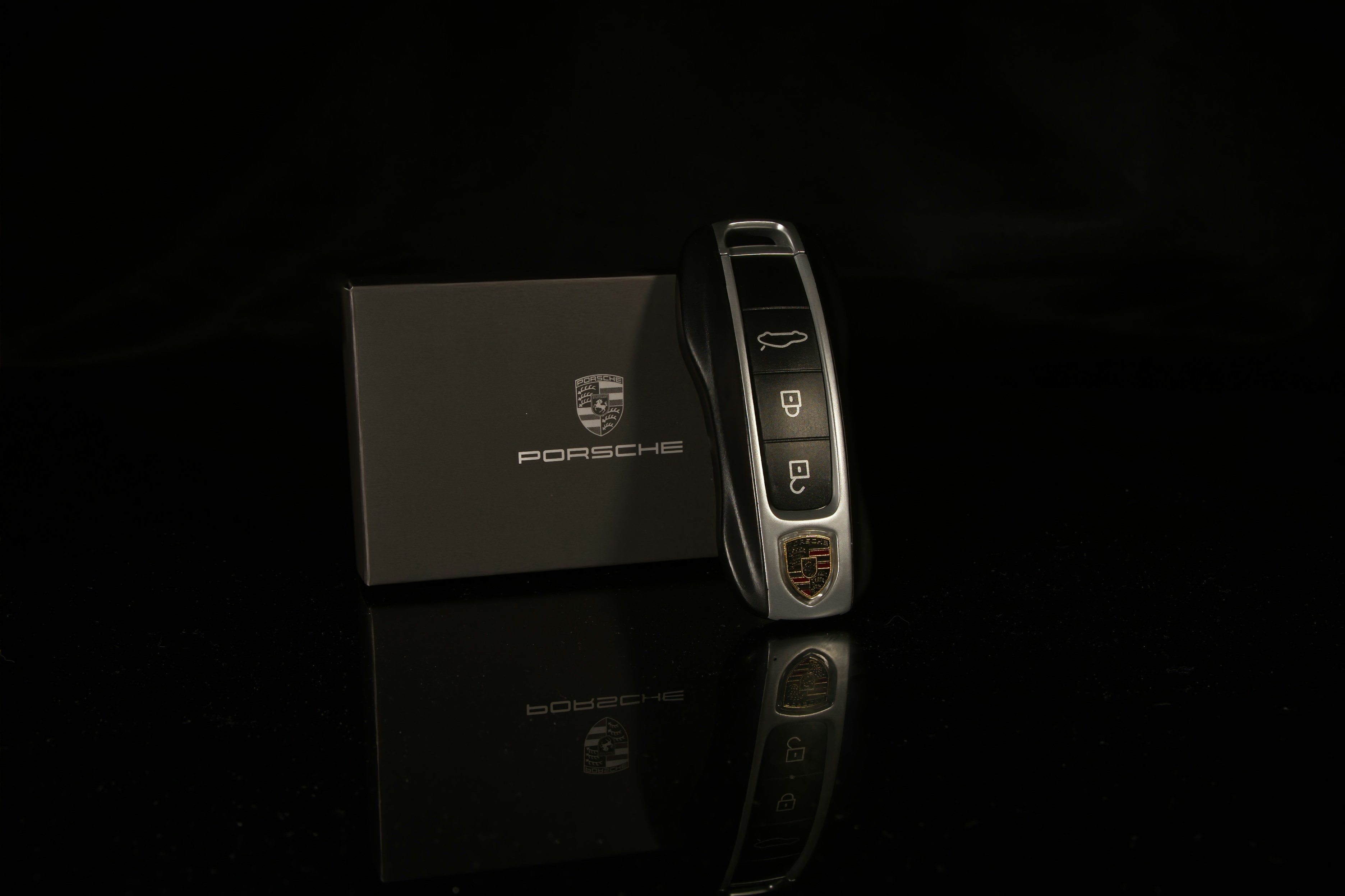 A cell phone sitting on top of a black table