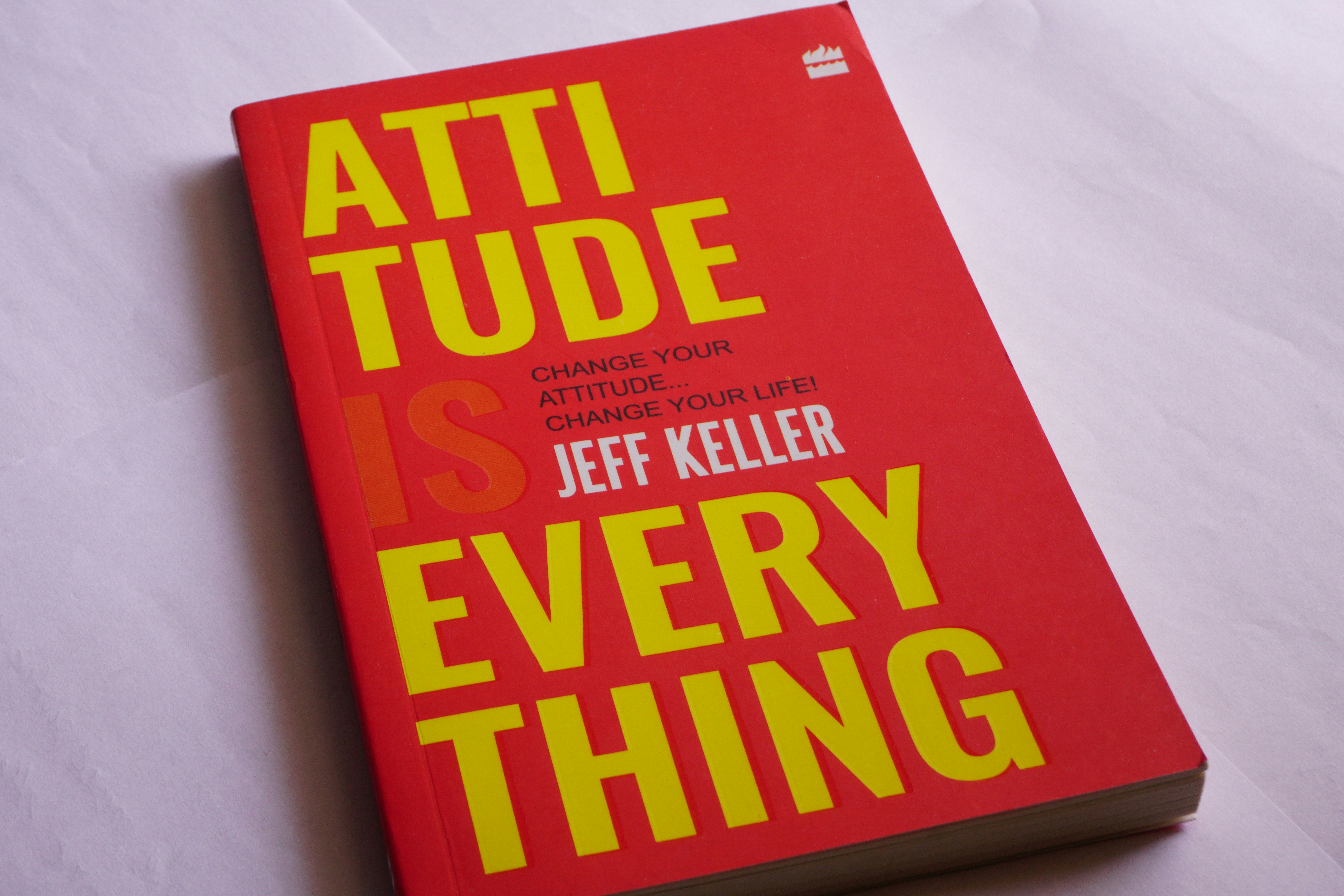 A red book sitting on top of a white table