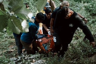 A group of people in the woods with a dog