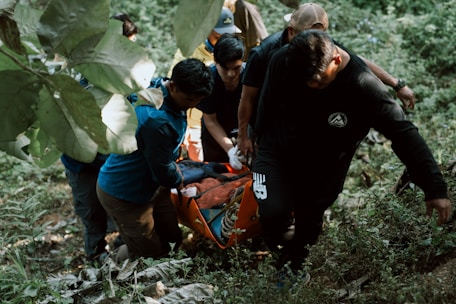 A group of people in the woods with a dog