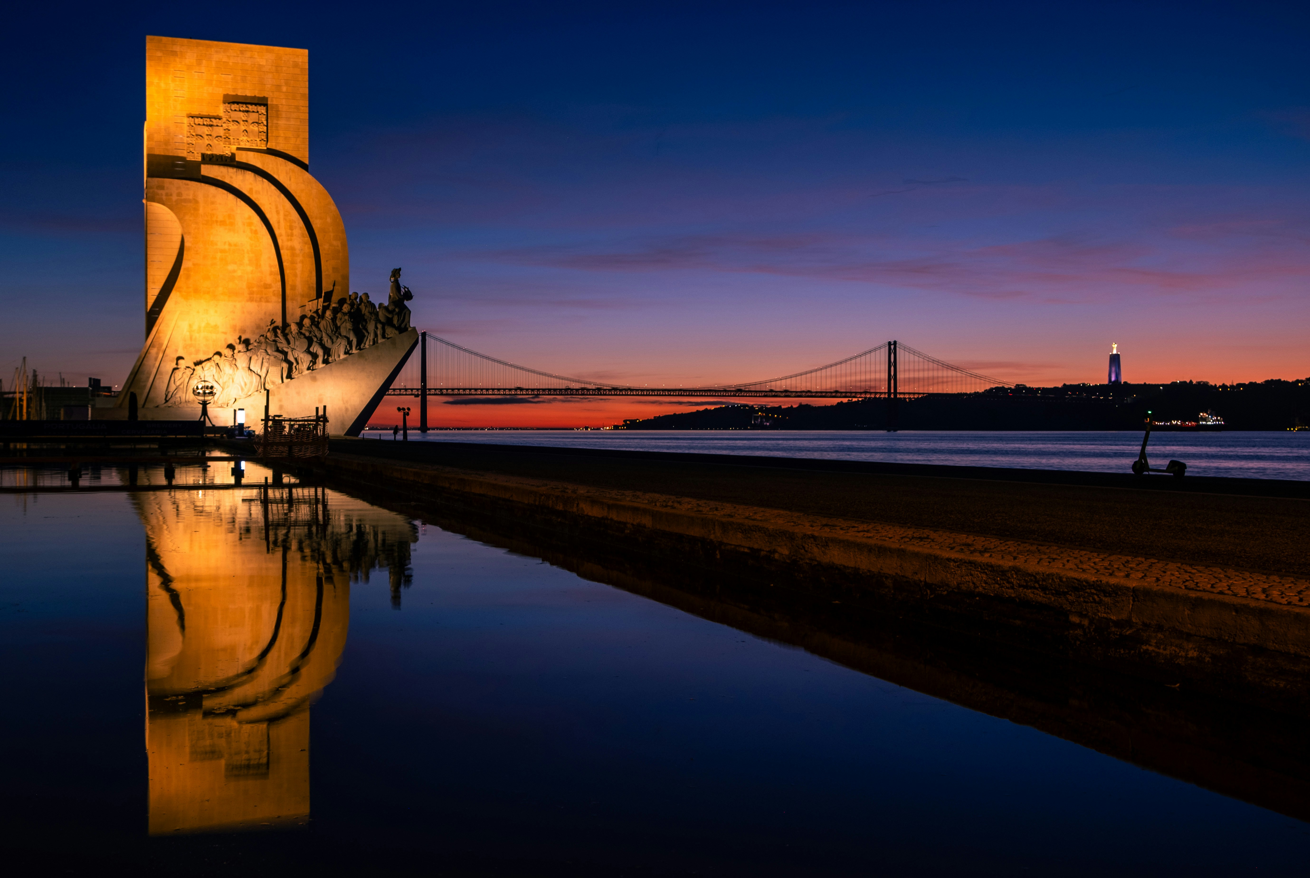 A very tall building sitting next to a body of water