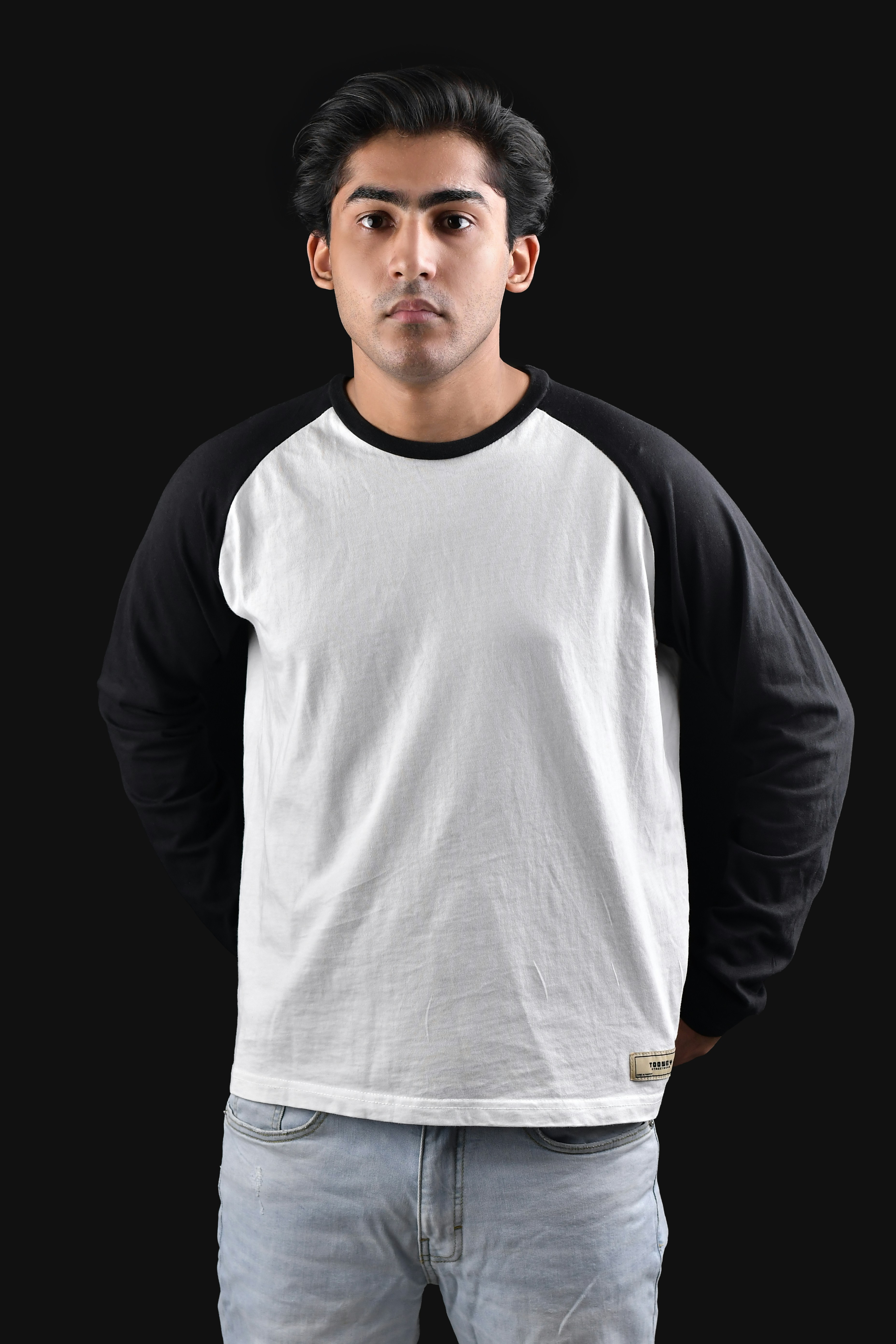 A man standing with his hands in his pockets