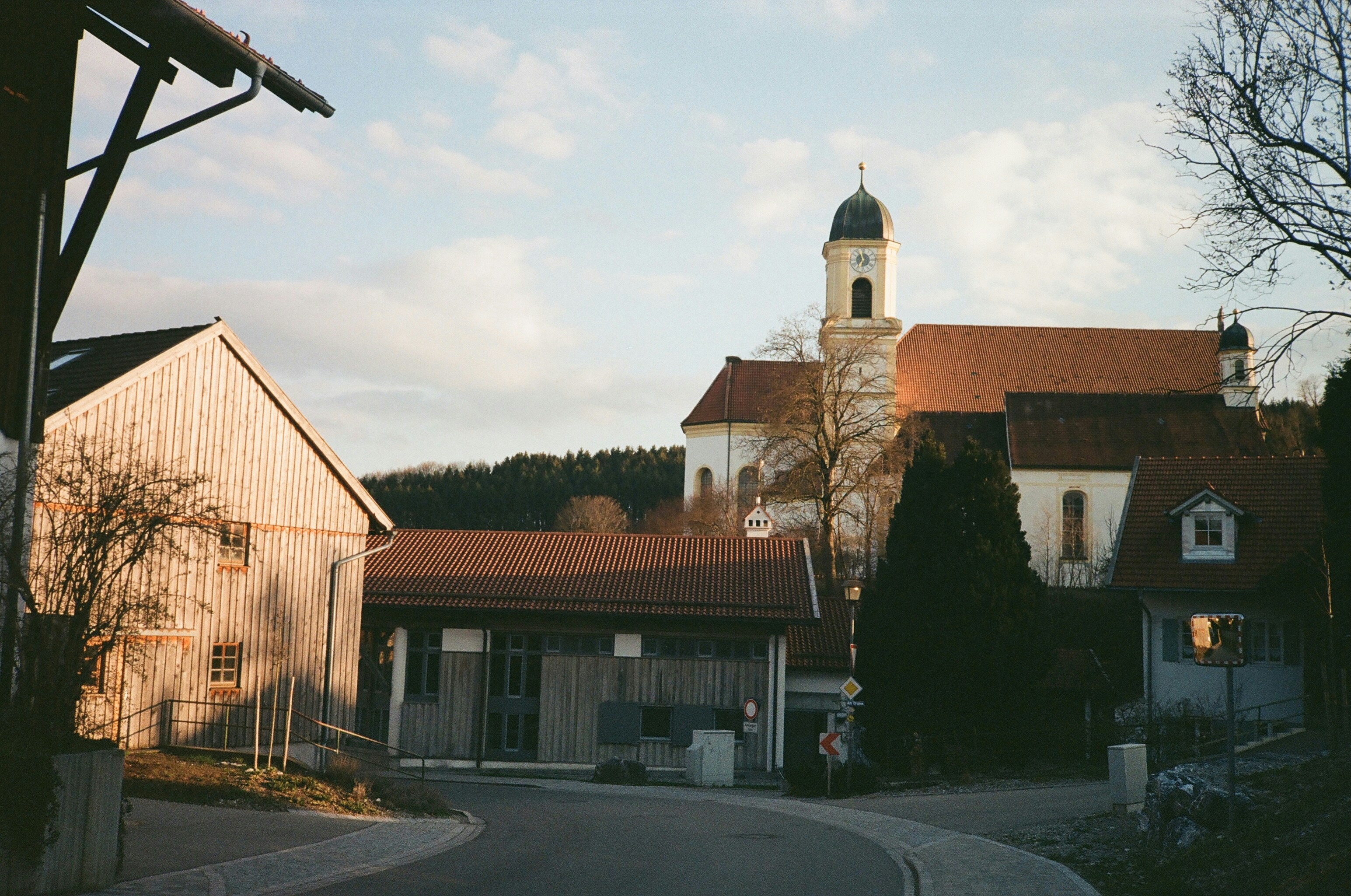 A street with a church in the background