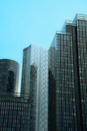 A couple of tall buildings sitting next to each other