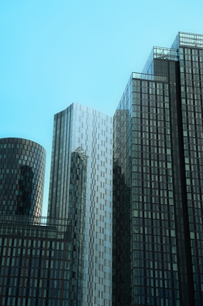 A couple of tall buildings sitting next to each other