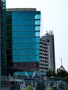 A very tall building with a clock on it's side