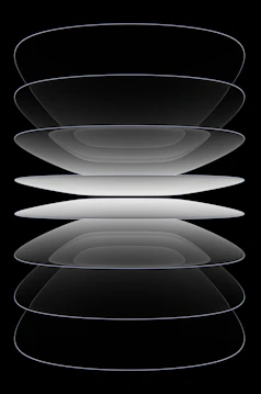 A black and white photo of a stack of plates