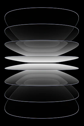 A black and white photo of a stack of plates
