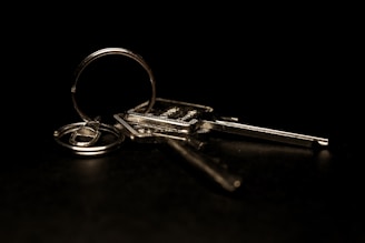 A pair of keys sitting on top of a table