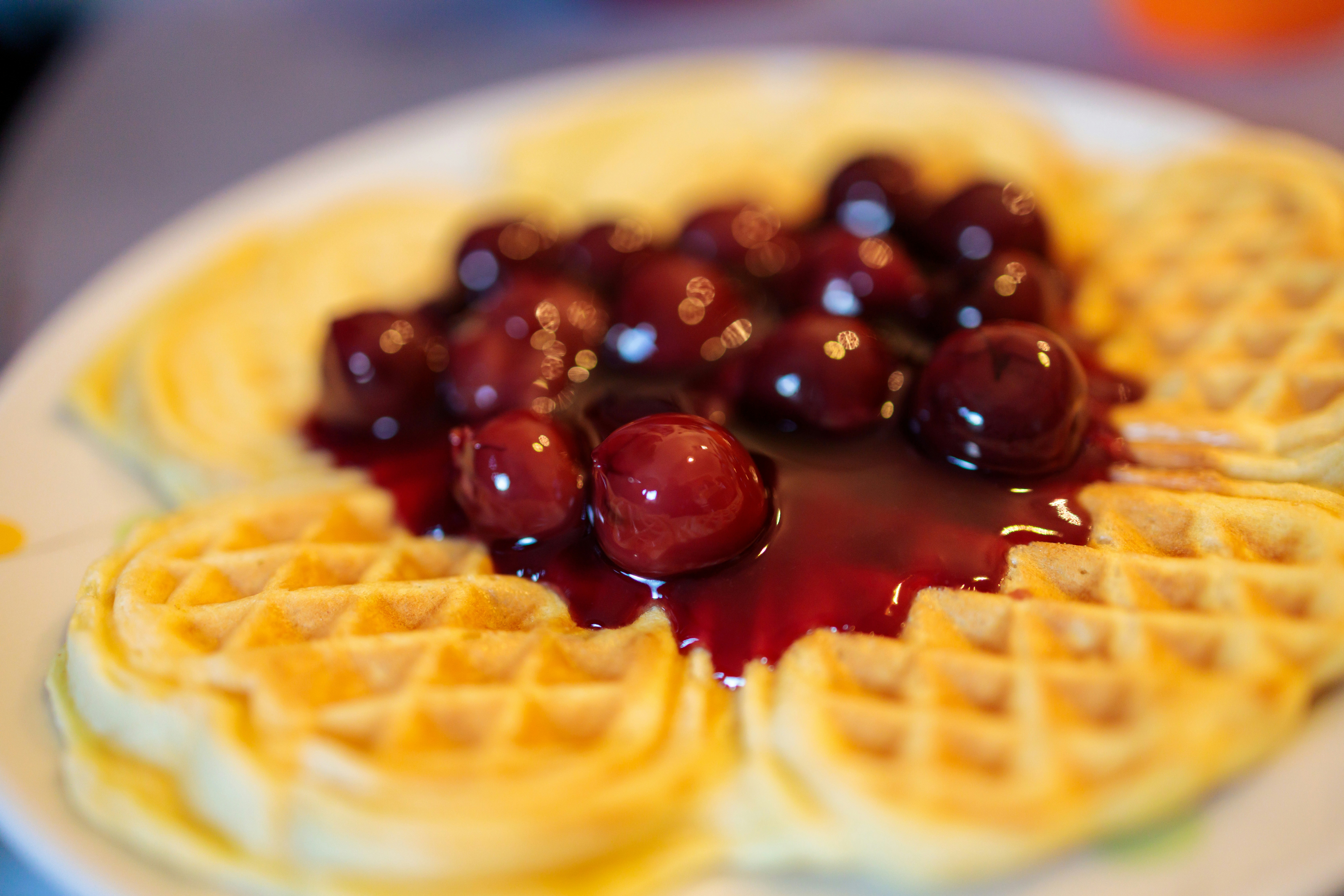 Heart waffles topped with cherries