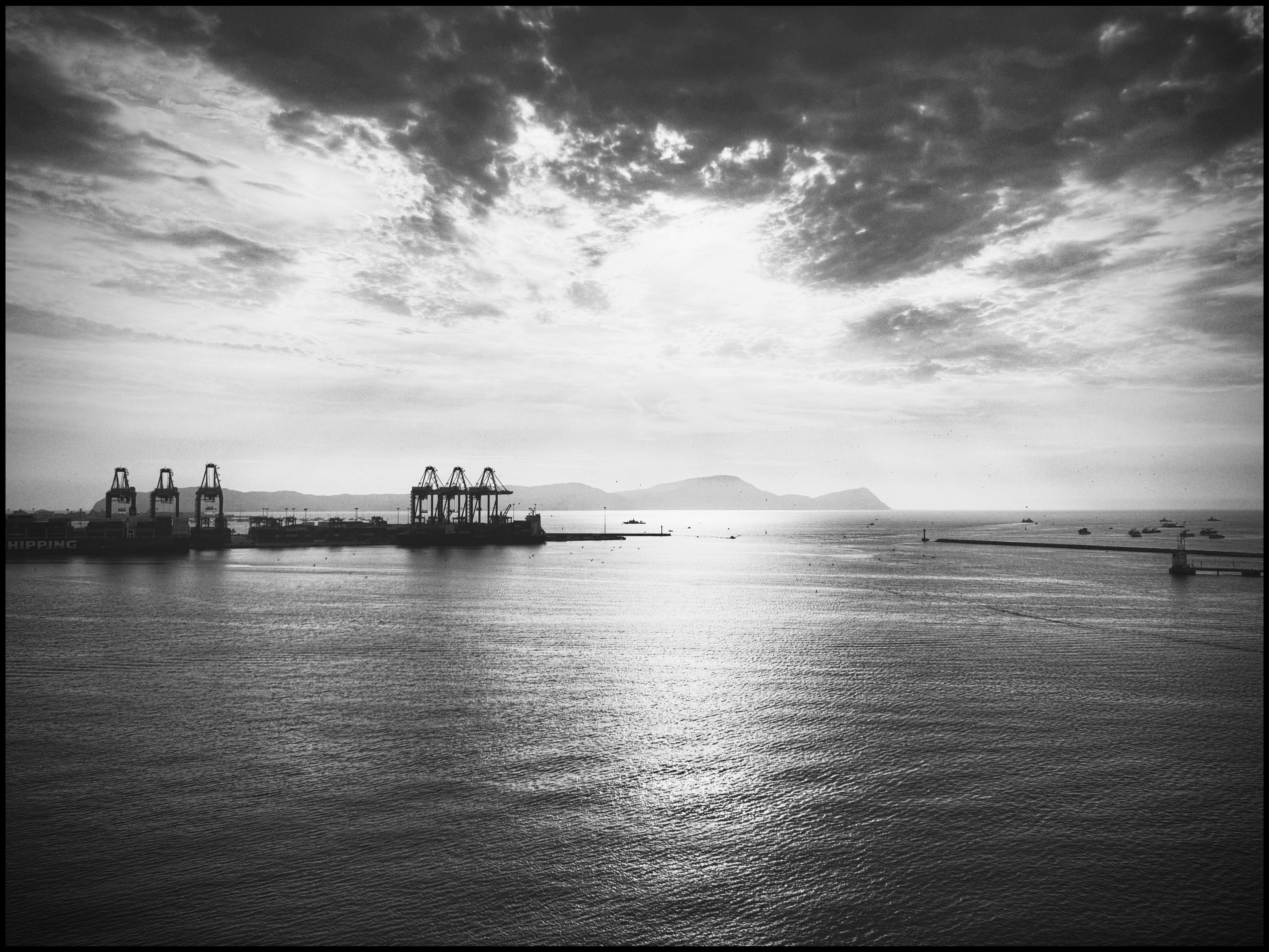 A black and white photo of a large body of water