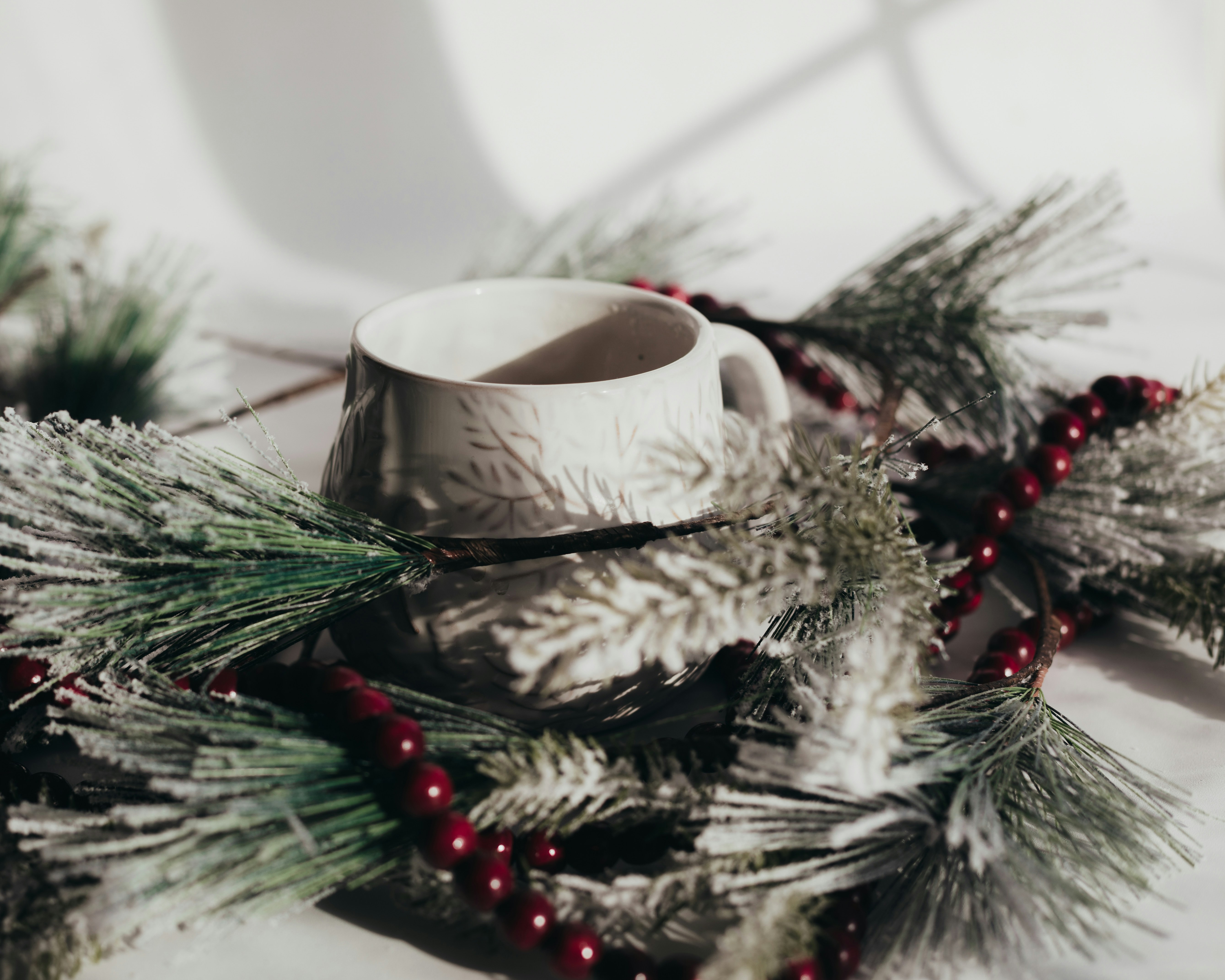 A white cup sitting on top of a table