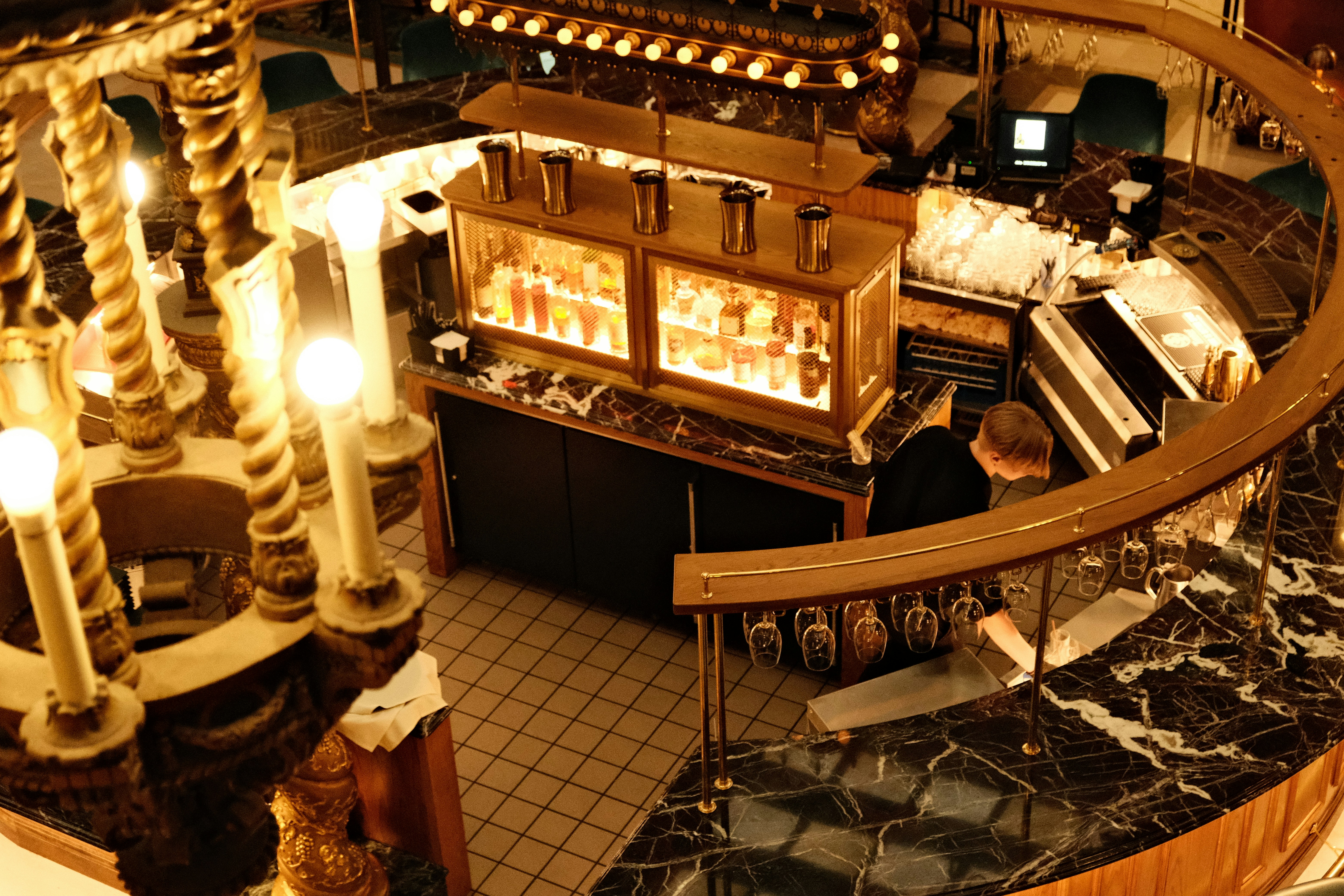 An overhead view of a restaurant with a spiral staircase