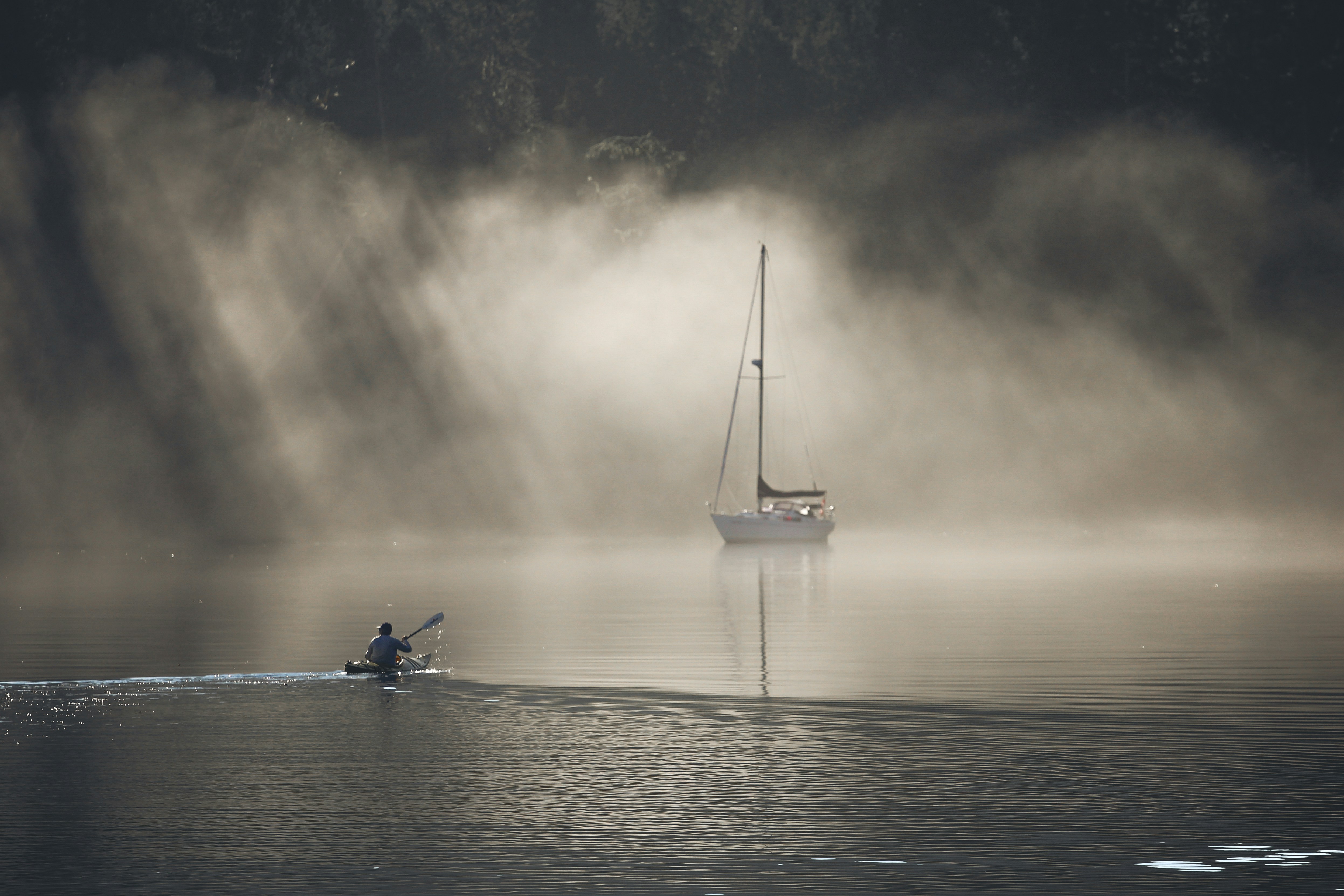 A boat floating on top of a body of water