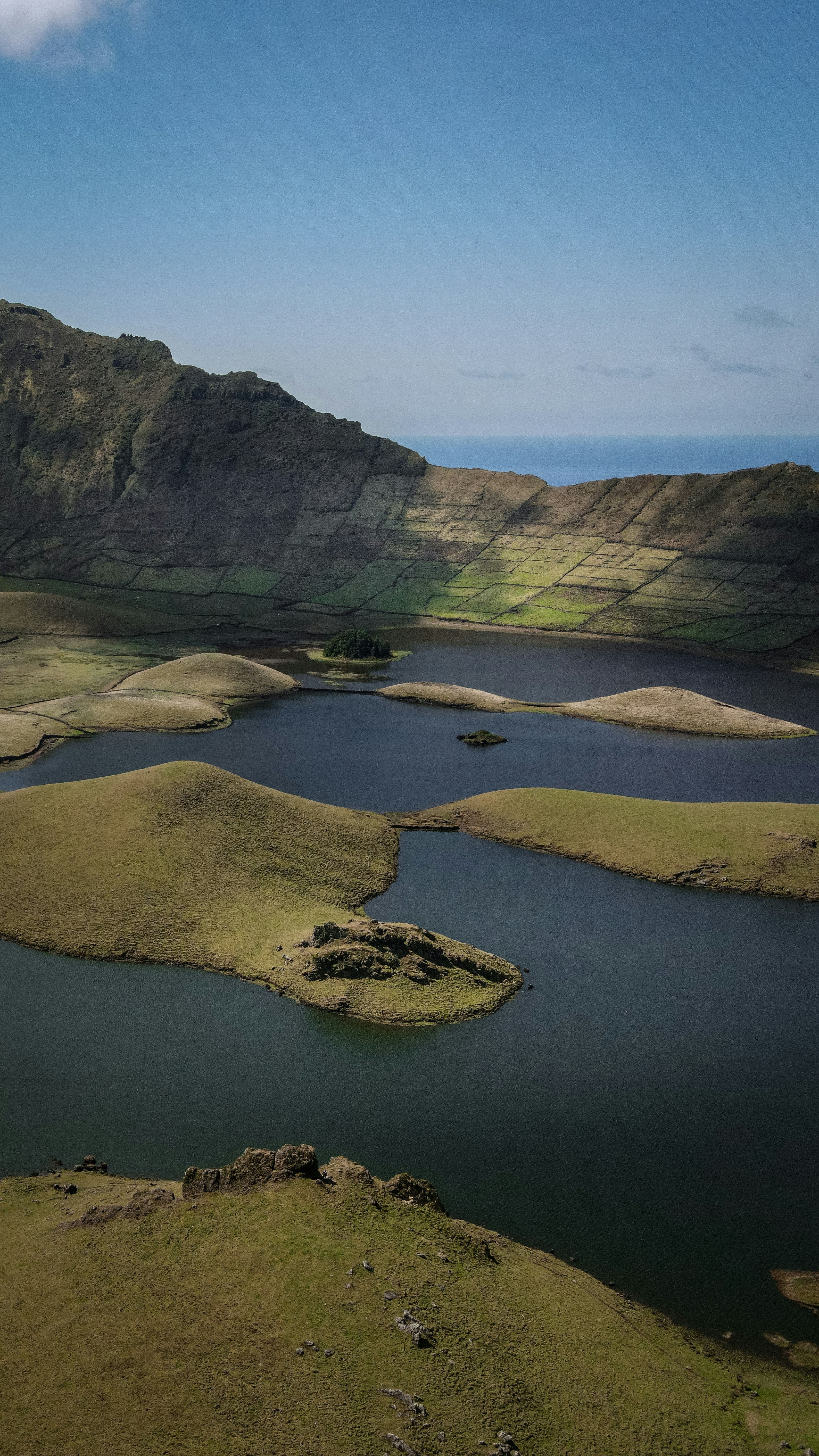 A large body of water surrounded by mountains