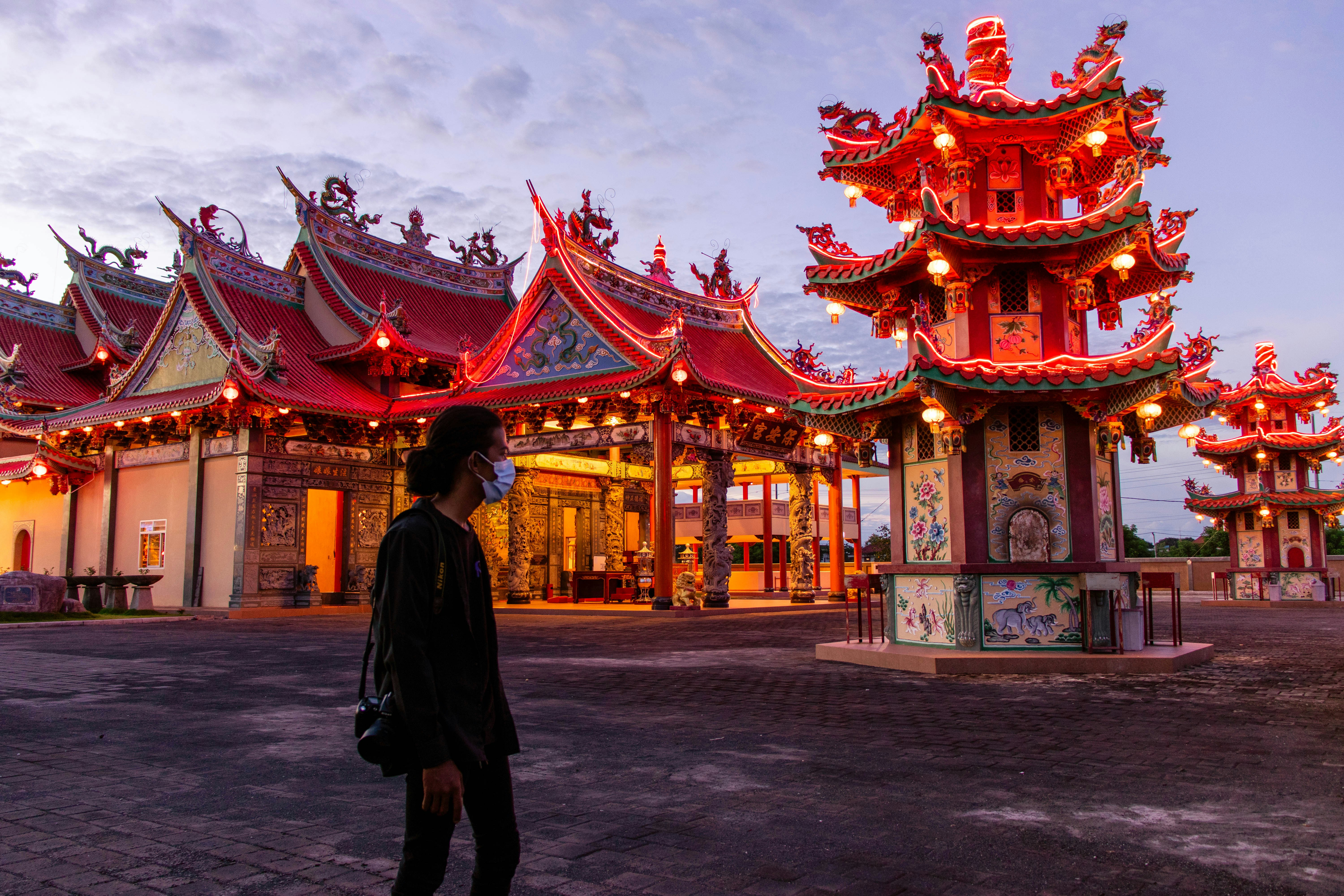 A person standing in front of a building