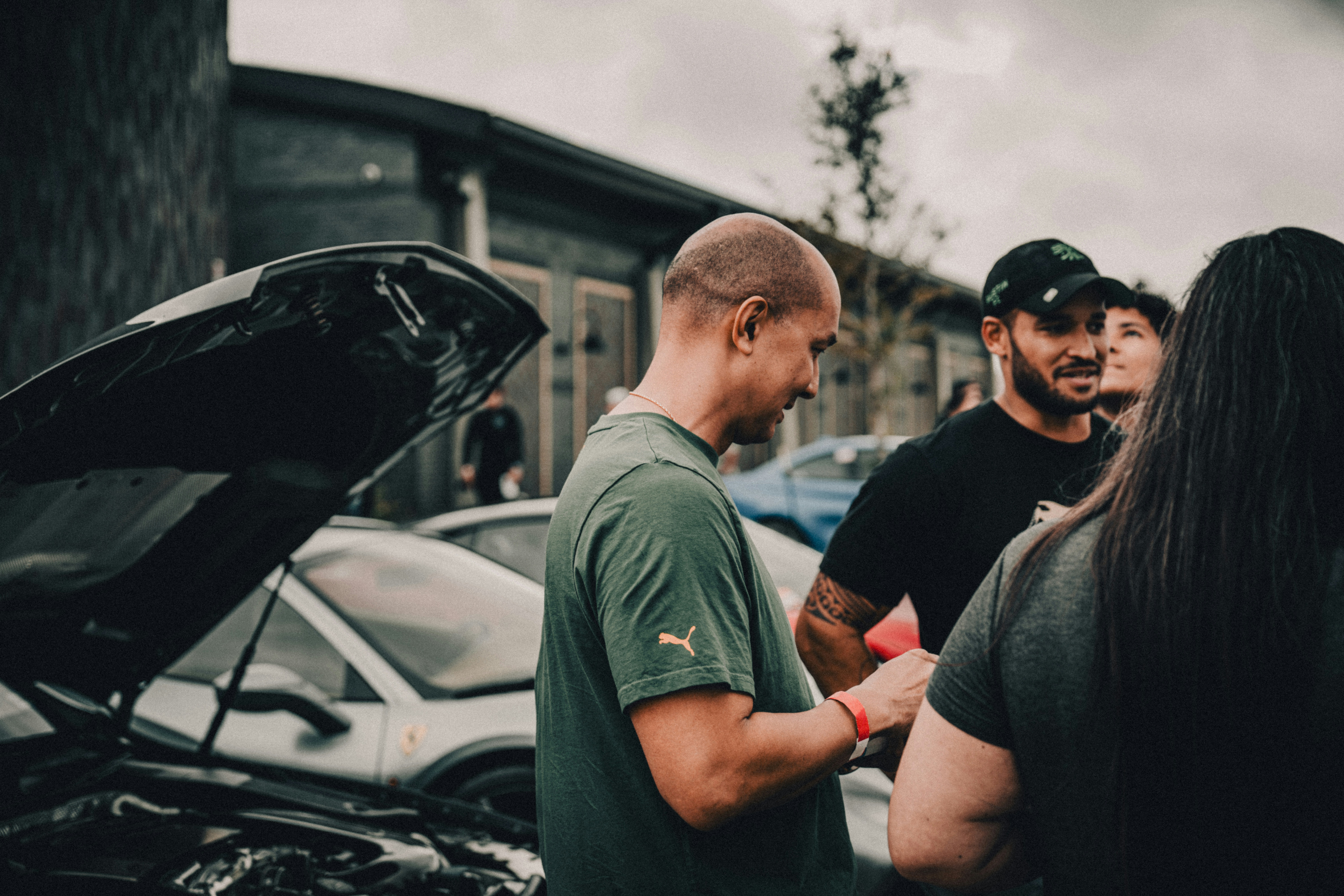 Dealer and customer discussing a vehicle during a test drive - auto dealer garage liability insurance