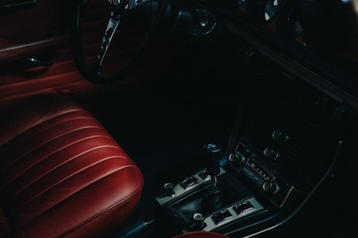 The interior of a car with red leather seats