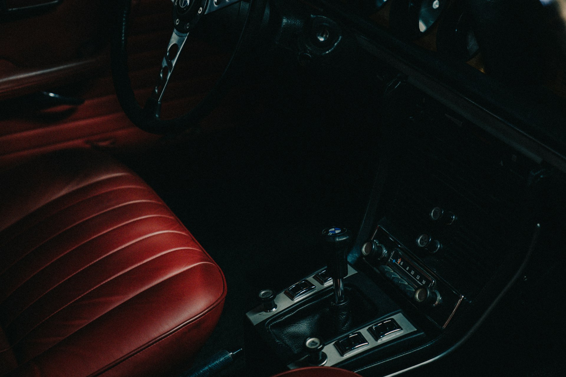 The interior of a car with red leather seats
