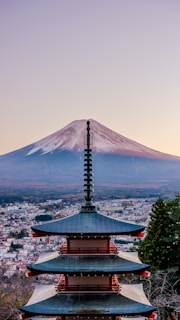 A pagoda with a mountain in the background
