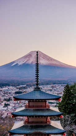 A pagoda with a mountain in the background