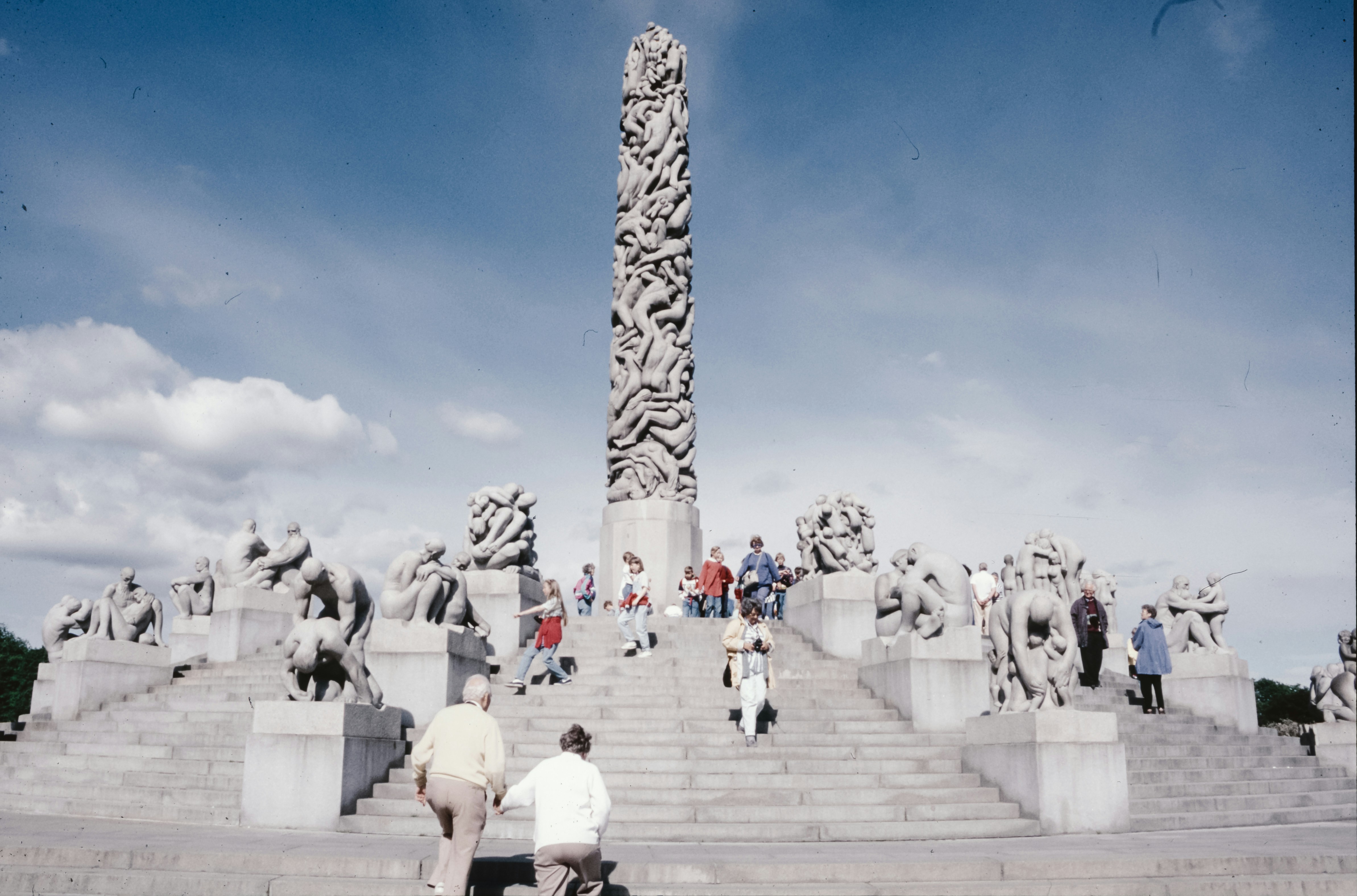 A group of people walking up a set of stairs