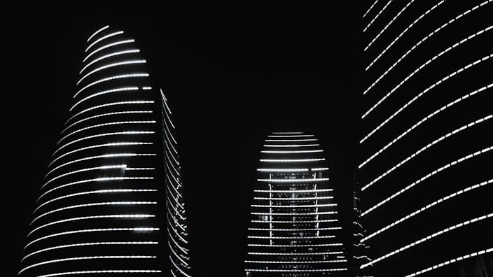 A black and white photo of a city at night