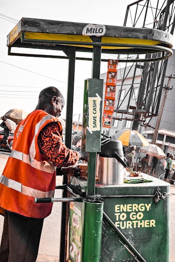 Market operator preparing beverages in Nigeria