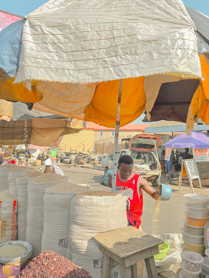 A trader at an open-air market stall