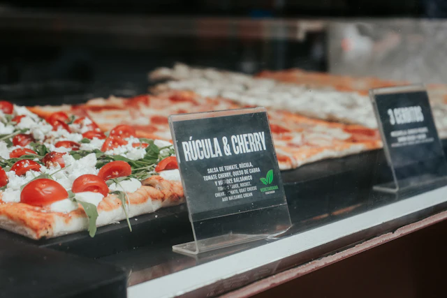 Typical pizza margherita al taglio with tomato, basil and mozzarella (sold by weight)