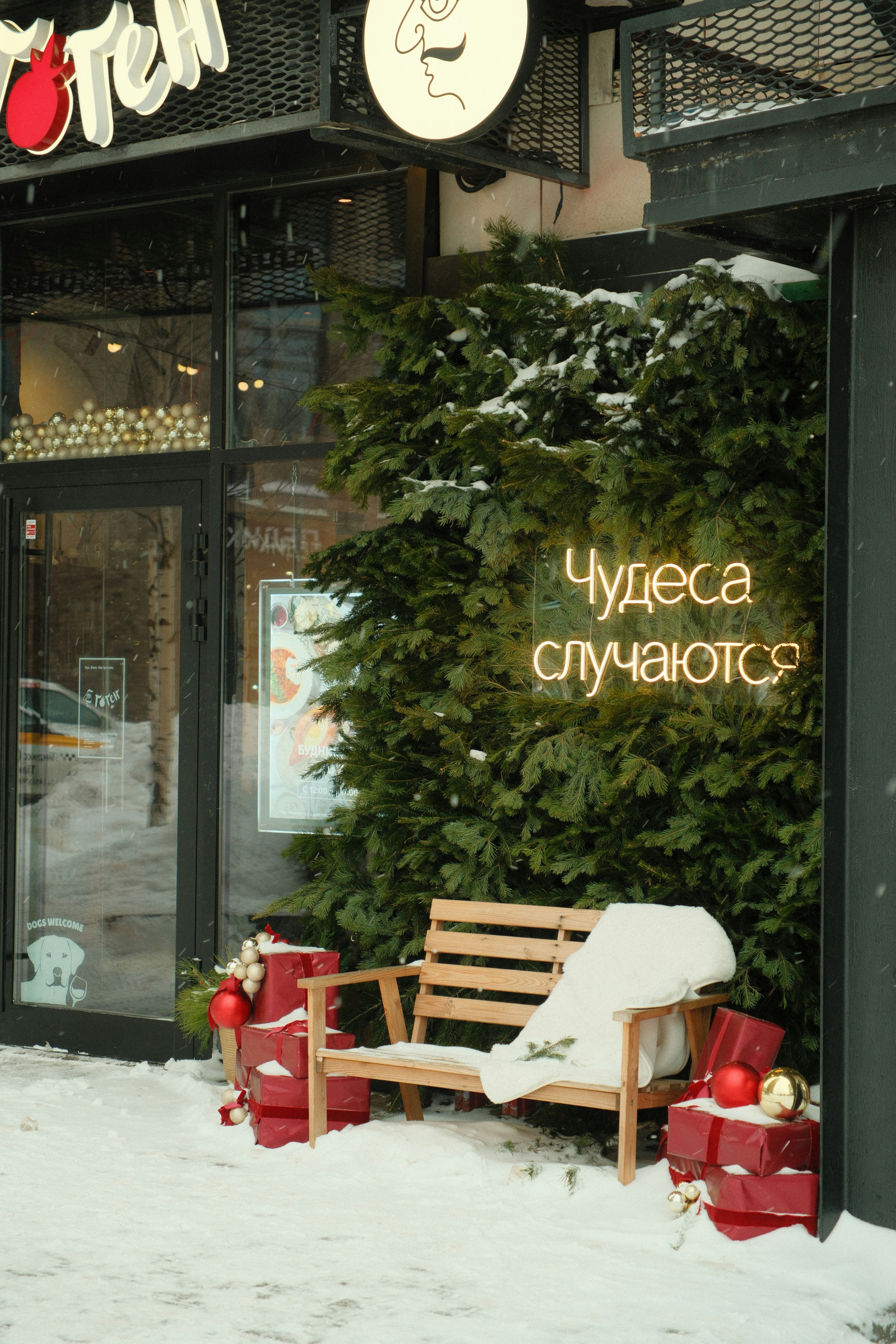 A wooden bench sitting in front of a store