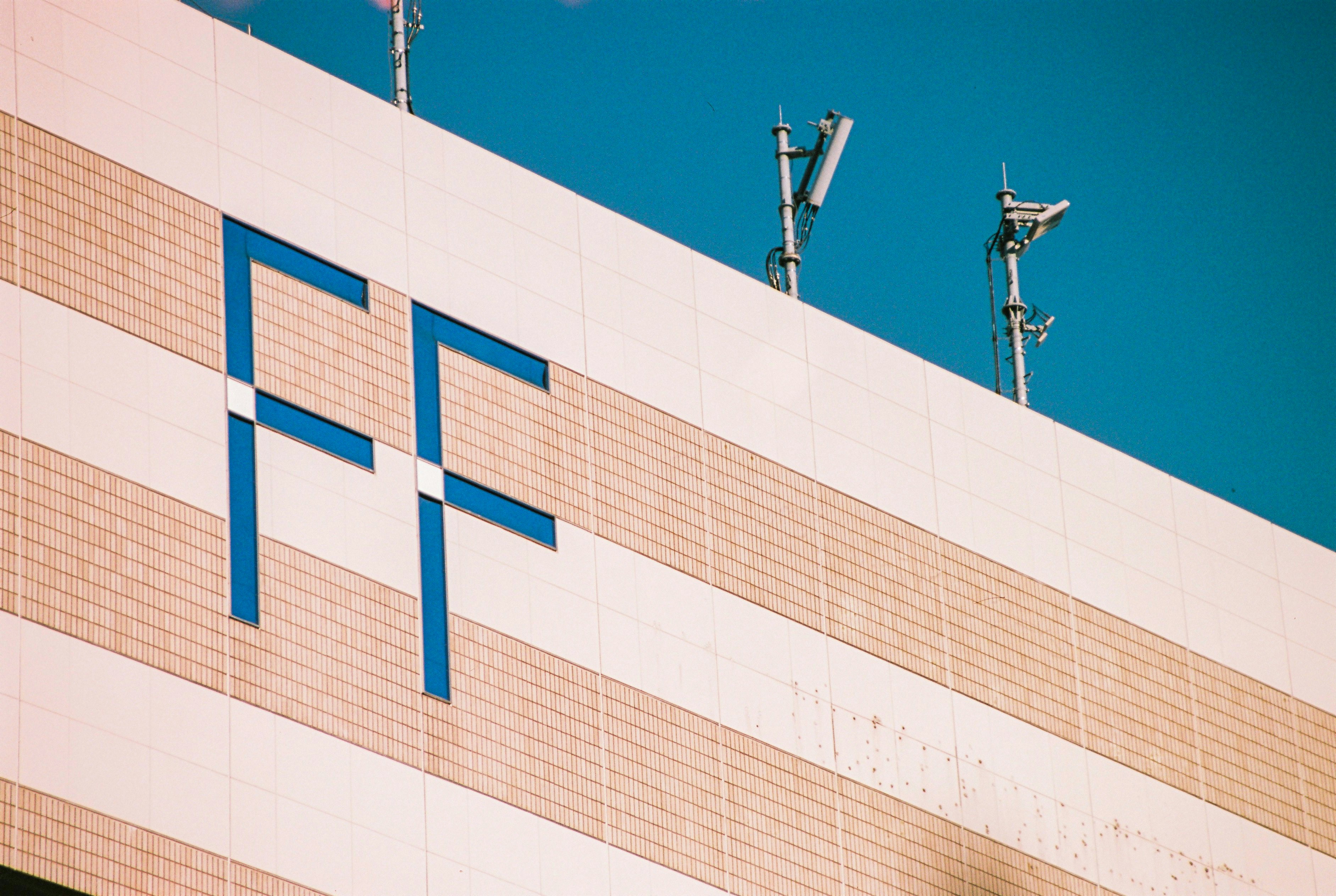 A tall building with a cross on the side of it